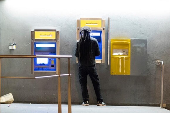 man at postfinace ATM