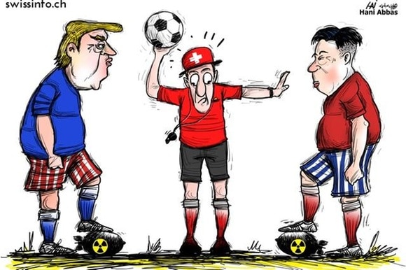 vignetta in cui donald trump e kim joung un si sfidano a calcio dove la palla è una bomba